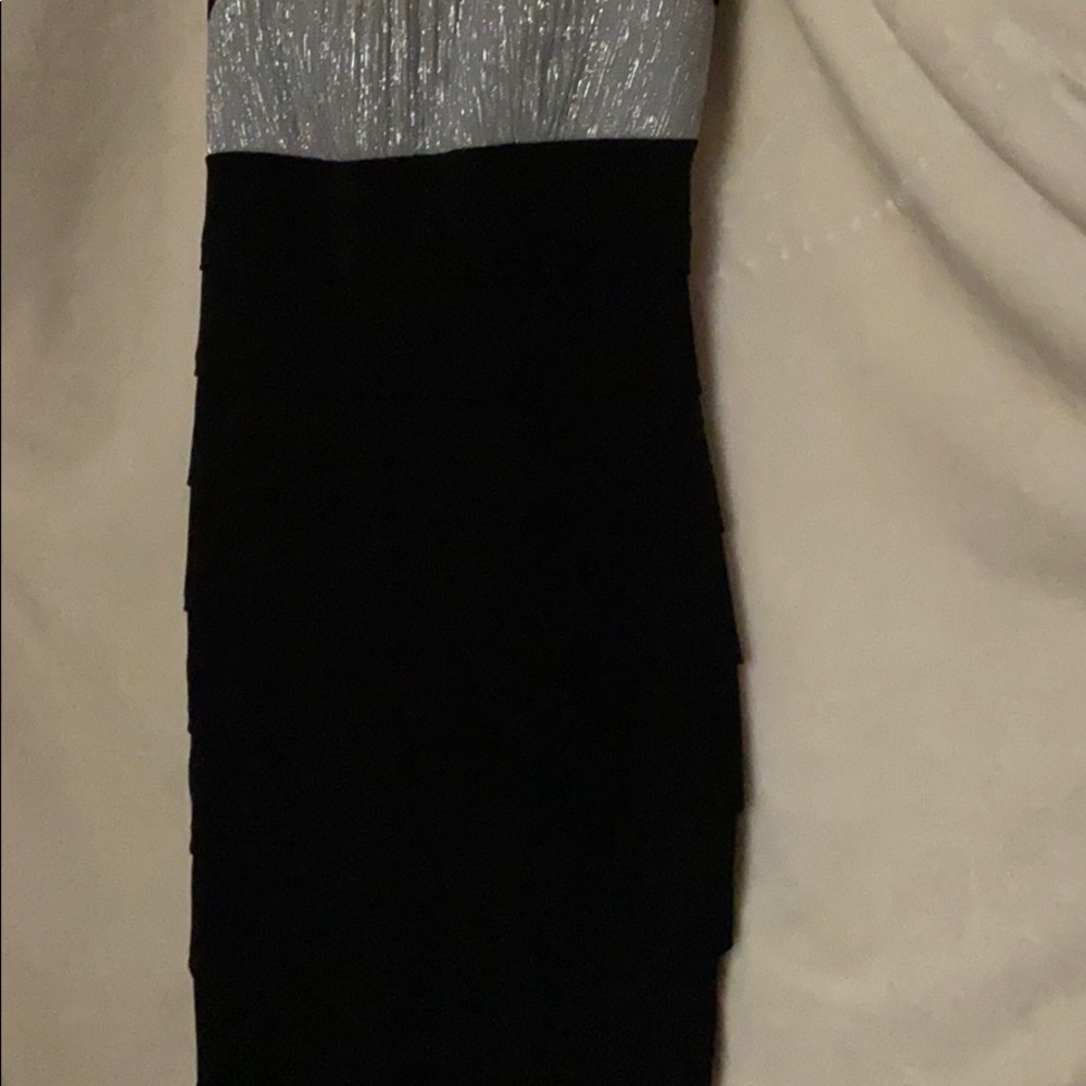 Black dress with a silvery top and thick strap